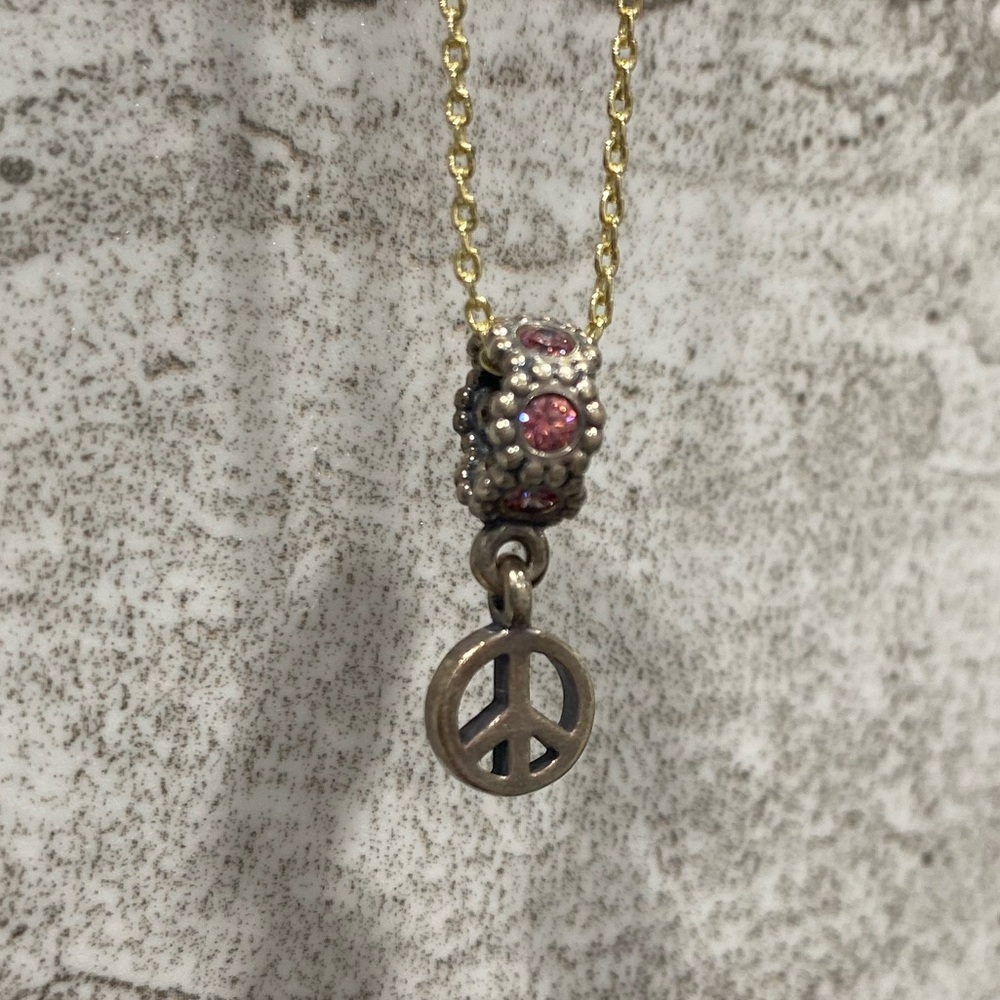 Pandora dangle peace sign charm with pink crystals